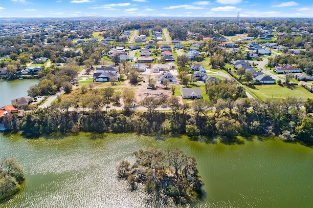 birds eye view of property featuring a water view and a residential view