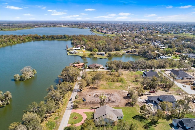 drone / aerial view with a water view and a residential view