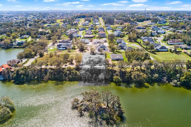 birds eye view of property with a residential view and a water view