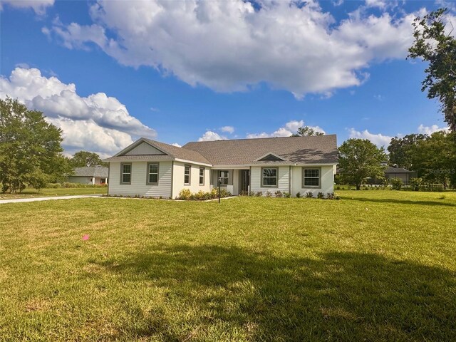2569 Rogers Rd, Lakeland, FL 33812 - single story home featuring a front lawn