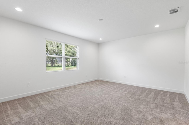 2569 Rogers Rd, Lakeland, FL 33812 - carpeted empty room with recessed lighting and baseboards