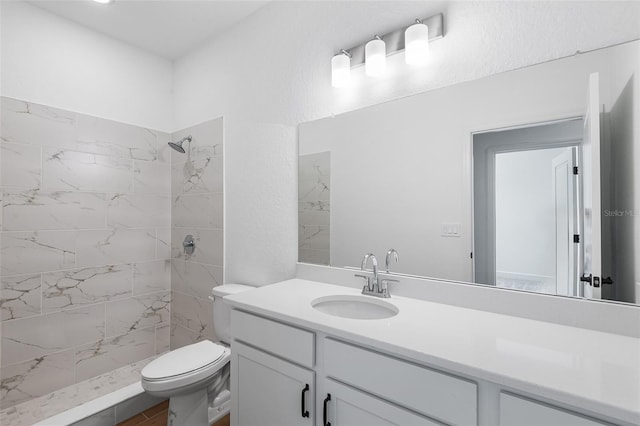 2569 Rogers Rd, Lakeland, FL 33812 - full bath featuring vanity, a tile shower, and wood finished floors