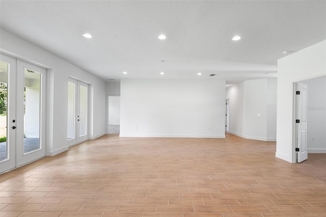2569 Rogers Rd, Lakeland, FL 33812 - spare room featuring french doors, recessed lighting, and light wood-style floors