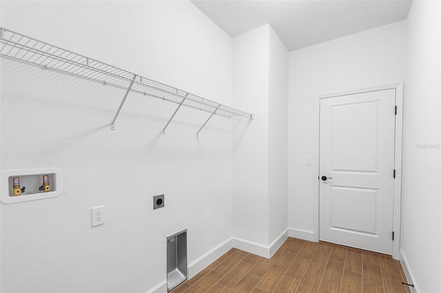 2569 Rogers Rd, Lakeland, FL 33812 - laundry room featuring hookup for an electric dryer, wood tiled floors, and washer hookup