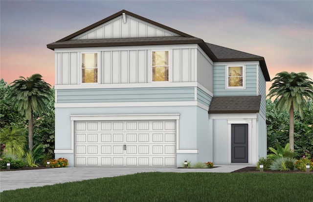 view of front of home with board and batten siding, a shingled roof, driveway, and an attached garage