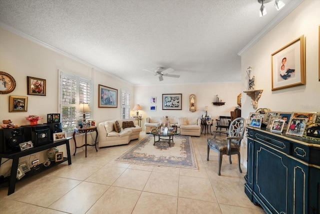 living area featuring light tile patterned floors, ceiling fan, ornamental molding, and a textured ceiling