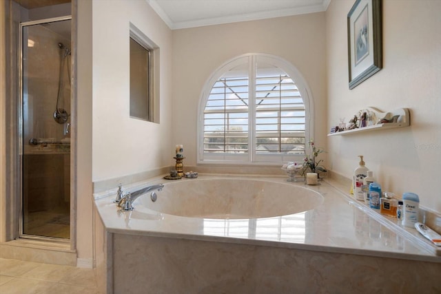 bathroom with a garden tub, a shower stall, crown molding, and tile patterned floors