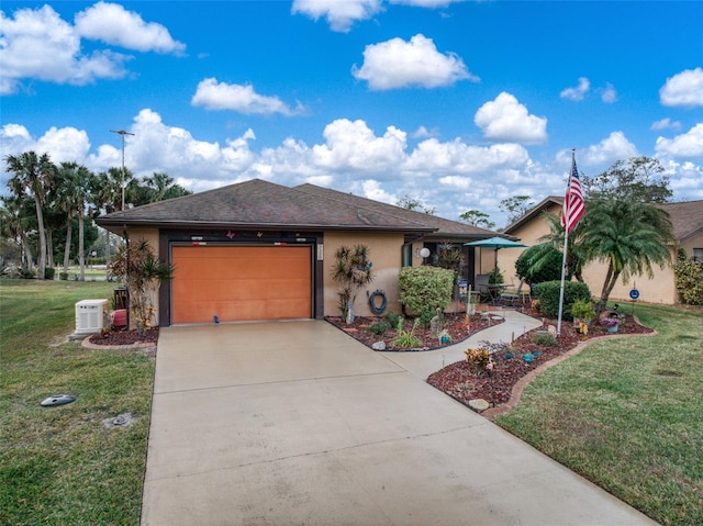 view of front of house with a garage and a front yard