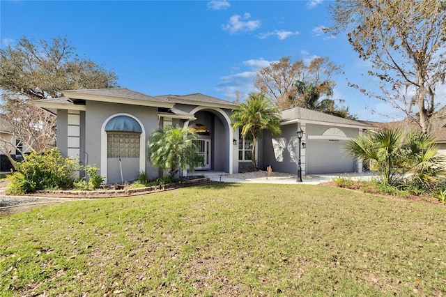 view of front facade featuring a front lawn and a garage