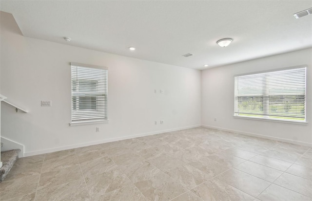 10352 Cross River Trl, Parrish, FL 34219 - unfurnished room with stairway, baseboards, light tile patterned floors, a smoke detector, and recessed lighting
