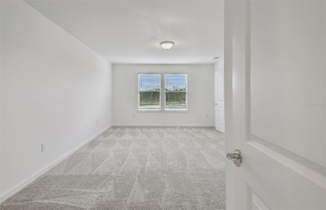 10352 Cross River Trl, Parrish, FL 34219 - spare room featuring light colored carpet and baseboards