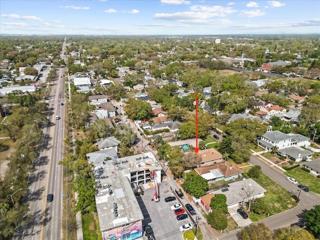 birds eye view of property with a residential view