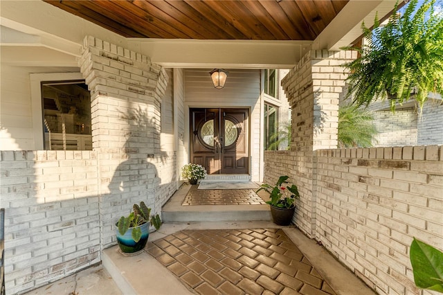 entrance to property with brick siding