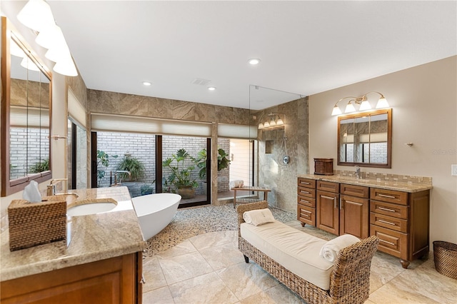 full bath featuring a soaking tub, a walk in shower, visible vents, and a sink