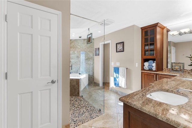 bathroom with double vanity, a walk in shower, and a sink