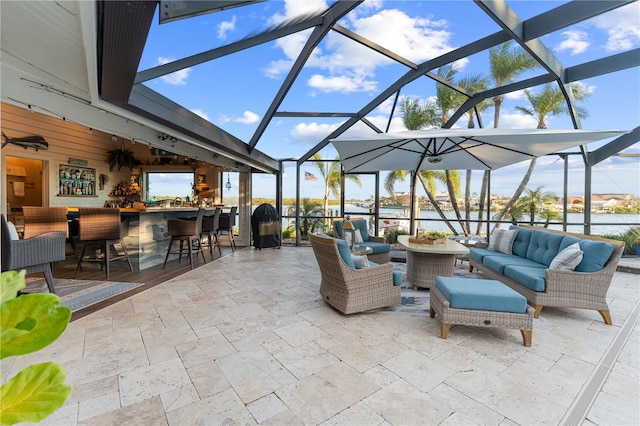 view of patio featuring an outdoor living space, a lanai, and outdoor dry bar