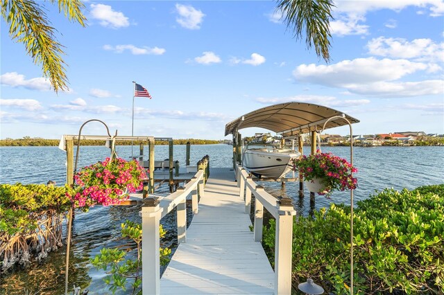 view of dock featuring a water view and boat lift