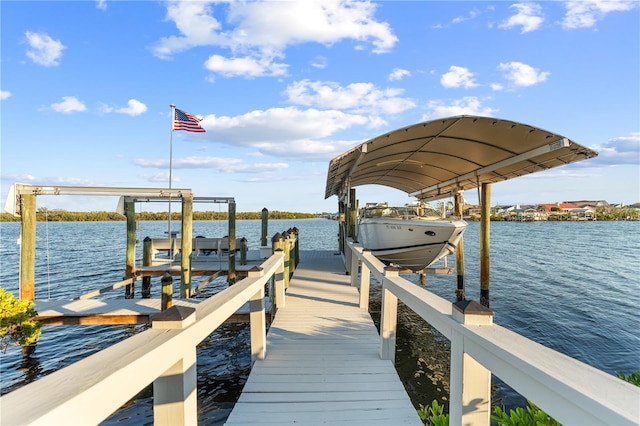 view of dock with a water view and boat lift