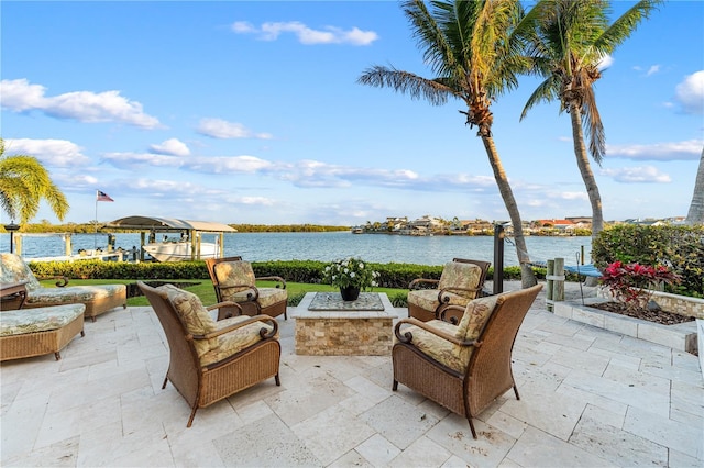 view of patio / terrace featuring an outdoor living space and a water view