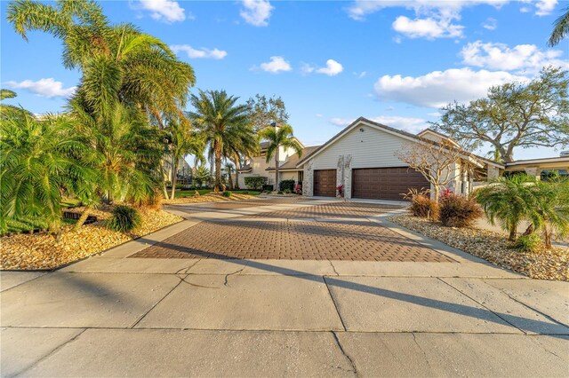 view of front of house featuring decorative driveway and an attached garage