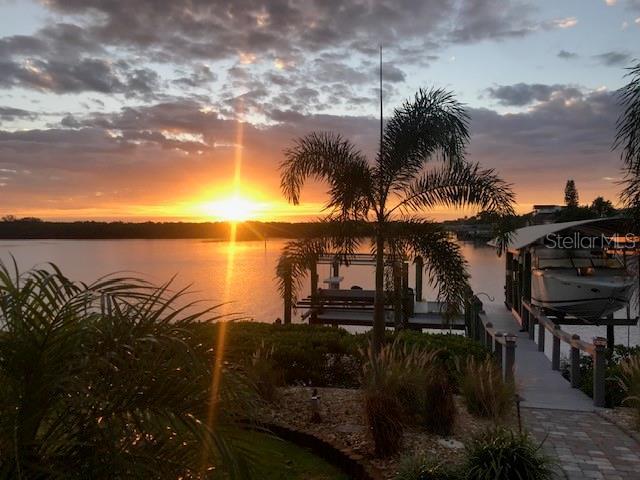 water view with boat lift and a dock