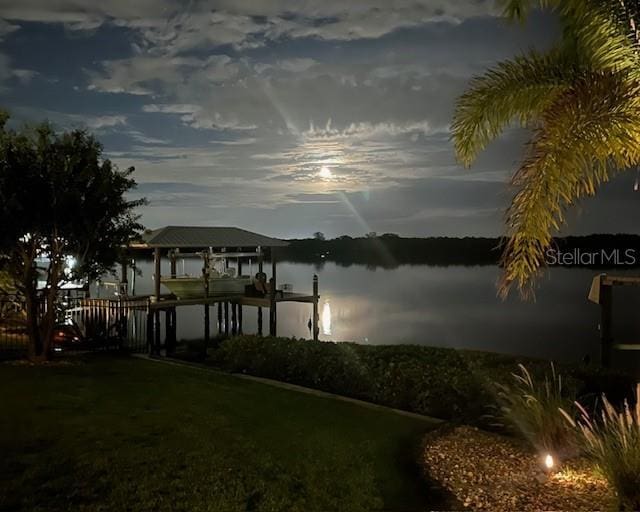 view of dock featuring a water view and boat lift