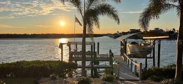 view of dock featuring a water view and boat lift