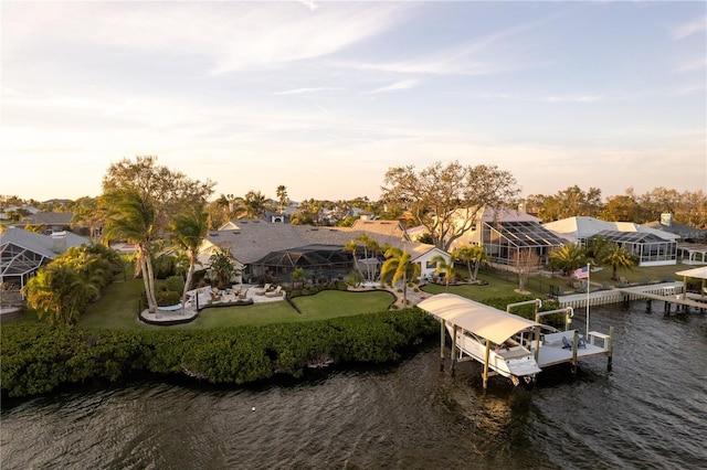 drone / aerial view featuring a residential view and a water view