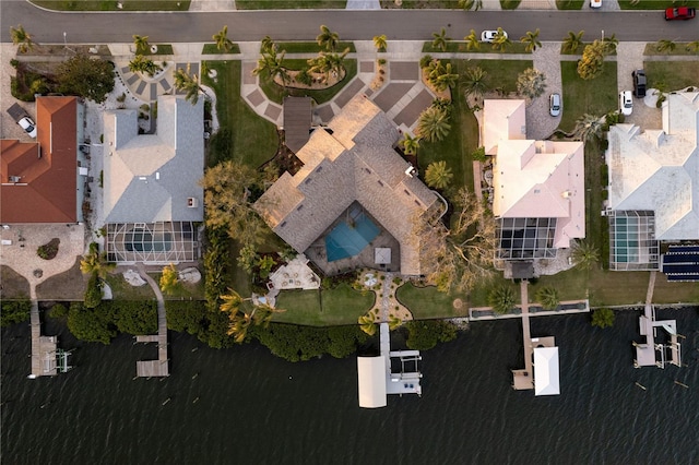 birds eye view of property featuring a residential view and a water view