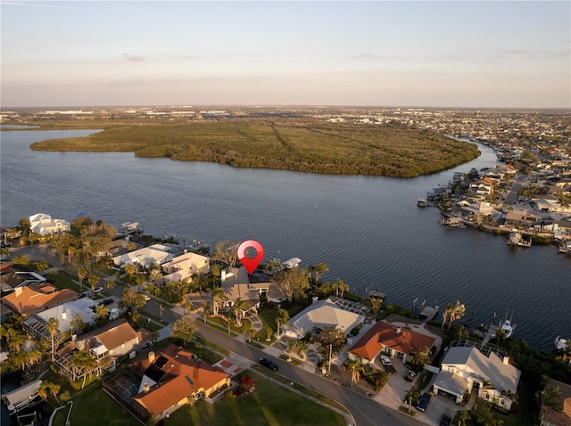 bird's eye view with a residential view and a water view