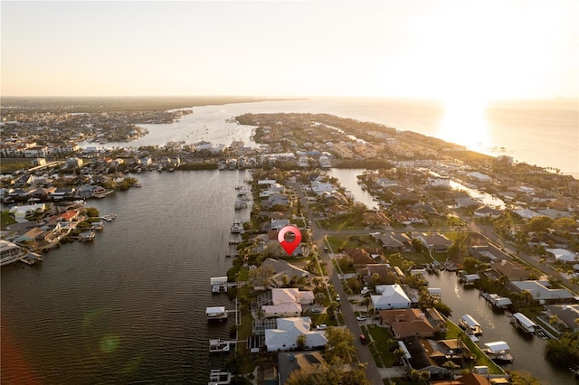 drone / aerial view with a residential view and a water view