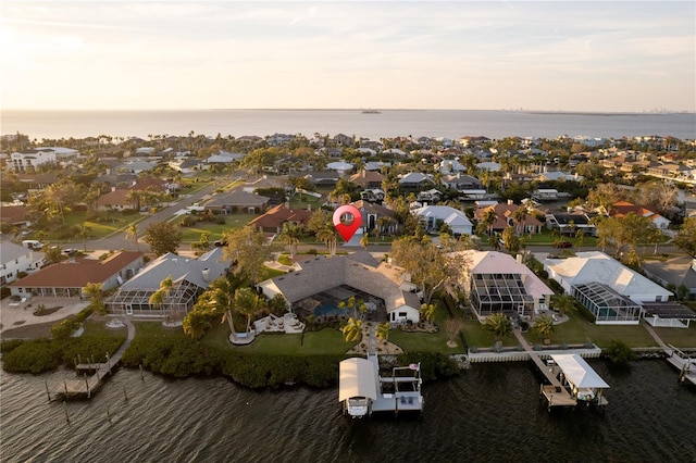 bird's eye view featuring a residential view and a water view