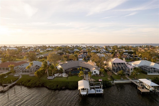 bird's eye view with a residential view and a water view