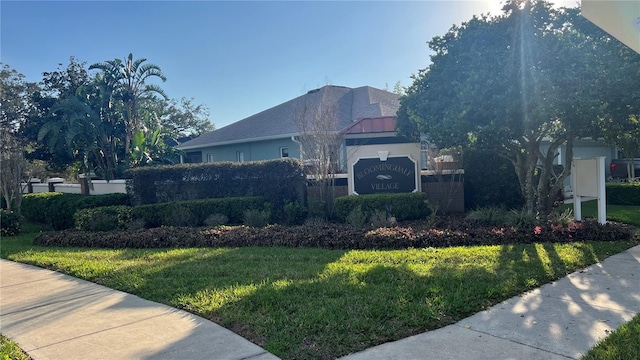 view of property exterior with a yard