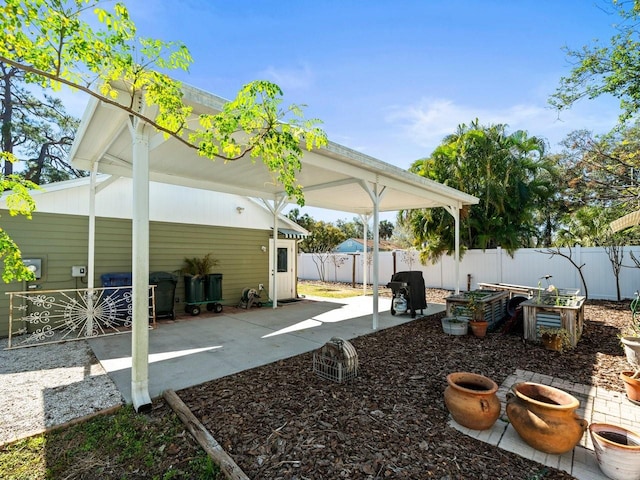 exterior space featuring a fenced backyard and a patio