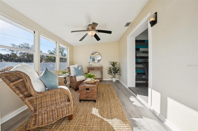 sunroom with ceiling fan