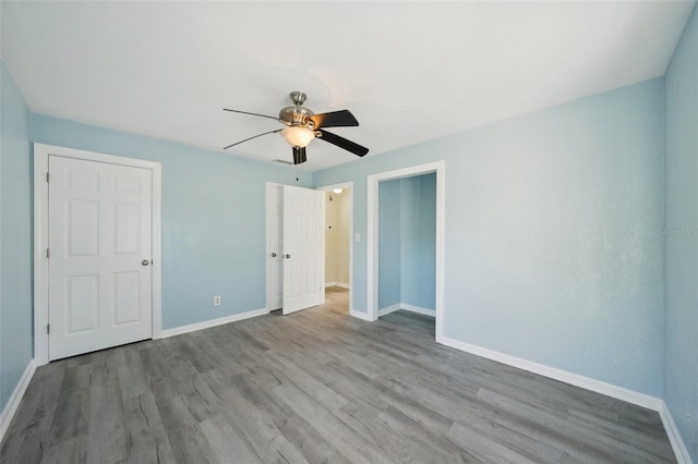 unfurnished bedroom featuring light hardwood / wood-style floors and ceiling fan