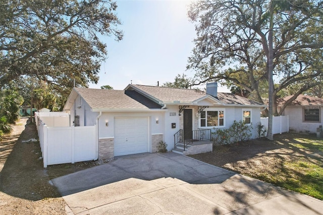 ranch-style house featuring a garage