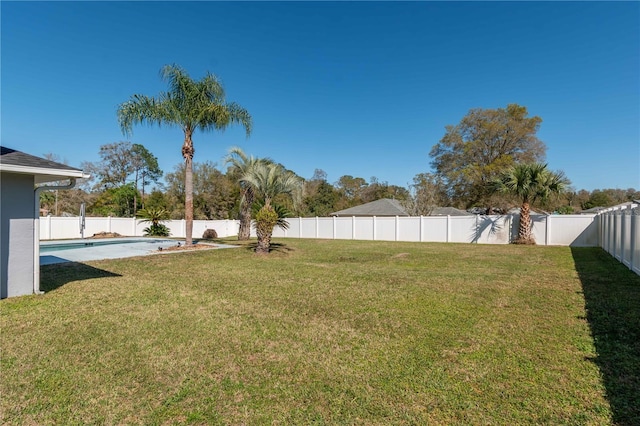 view of yard featuring a fenced backyard and a fenced in pool