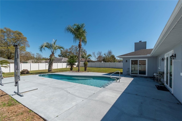 view of swimming pool featuring a patio area, a fenced backyard, a fenced in pool, and a yard