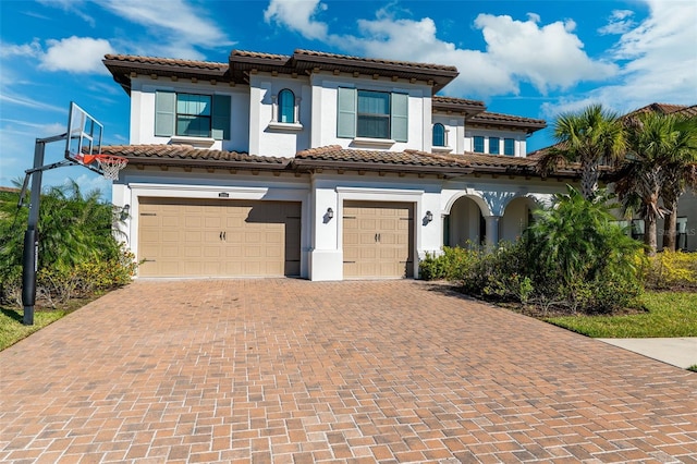 mediterranean / spanish-style home featuring a garage