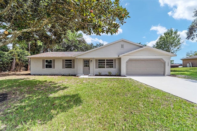 ranch-style home with an attached garage, a front lawn, concrete driveway, and stucco siding