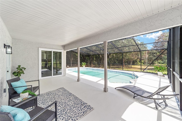 outdoor pool featuring a lanai and a patio