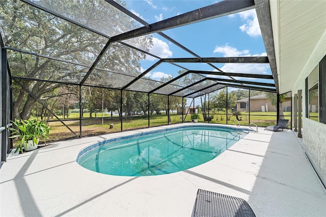 pool with a lanai and a patio