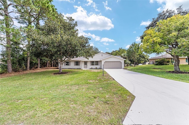 ranch-style home featuring a garage, driveway, and a front yard