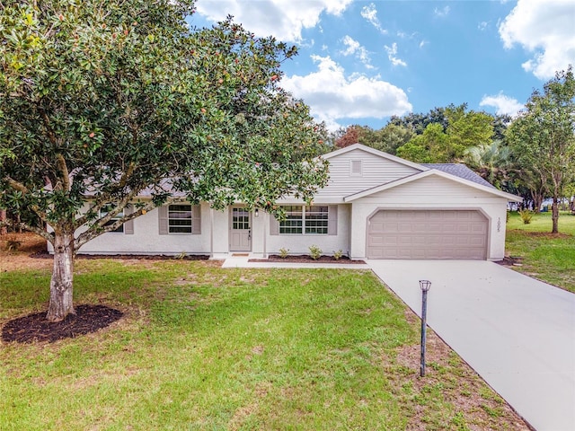 view of front of home with a garage, a front yard, and driveway