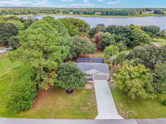 aerial view with a water view and a forest view