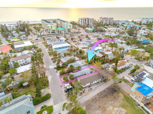 132 120th Ave, Treasure Island, FL 33706 - aerial view at dusk featuring a water view
