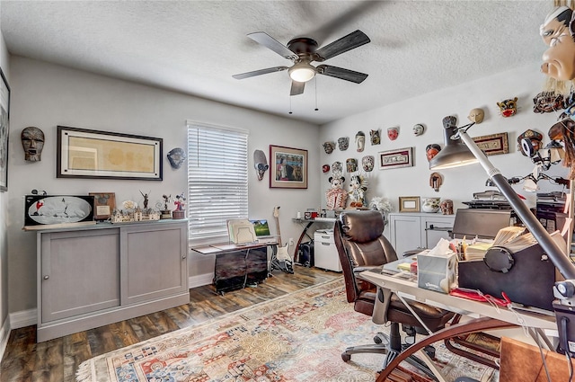 office space with dark wood-style floors, ceiling fan, and a textured ceiling