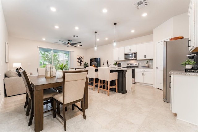 dining space featuring a ceiling fan, recessed lighting, and visible vents